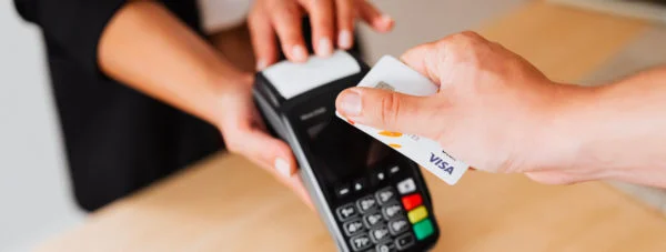 contactless card being placed on integrated payment terminal - retail payment integrations